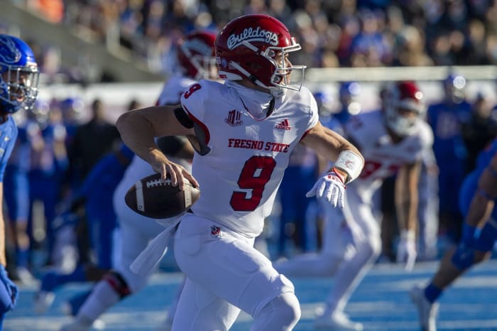 Fresno State Bulldogs quarterback Jake Haener (9) rolls out versus the Boise State Broncos. Mandatory Credit: Brian Losness-USA TODAY Sports
